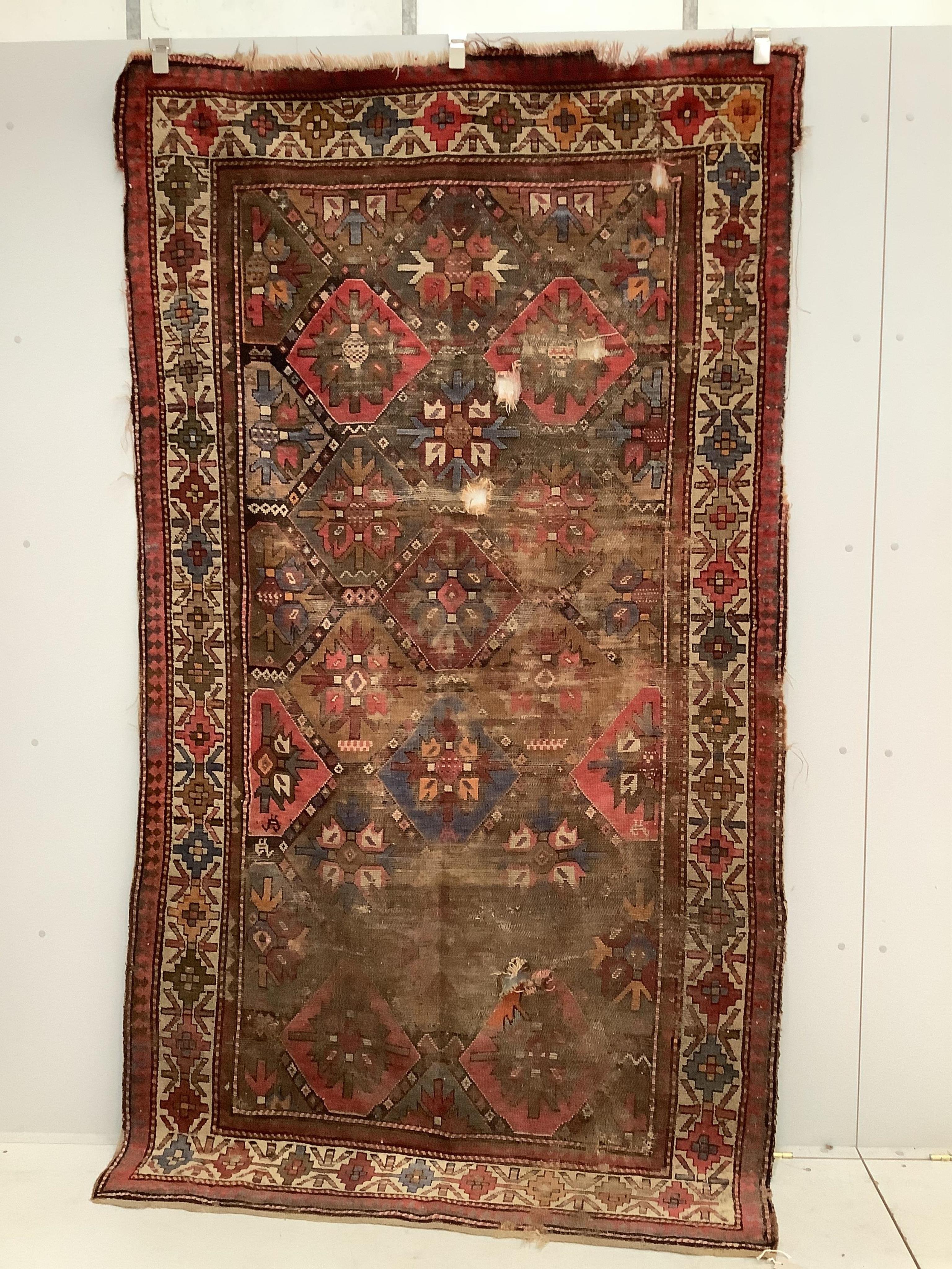 An antique Caucasian geometric rug, 250 x 140cm, together with a Belouch prayer rug, 130 x 78cm. Condition - poor